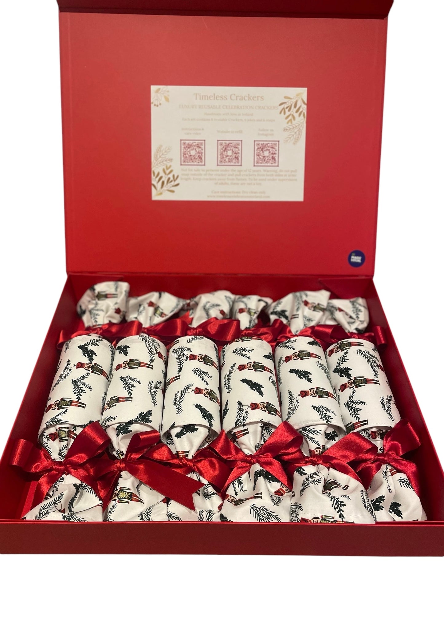 “Set of six luxury reusable Christmas crackers, in a Nutcracker white design in cotton with red satin bows in keepsake box, Timeless Celebrations Ireland”