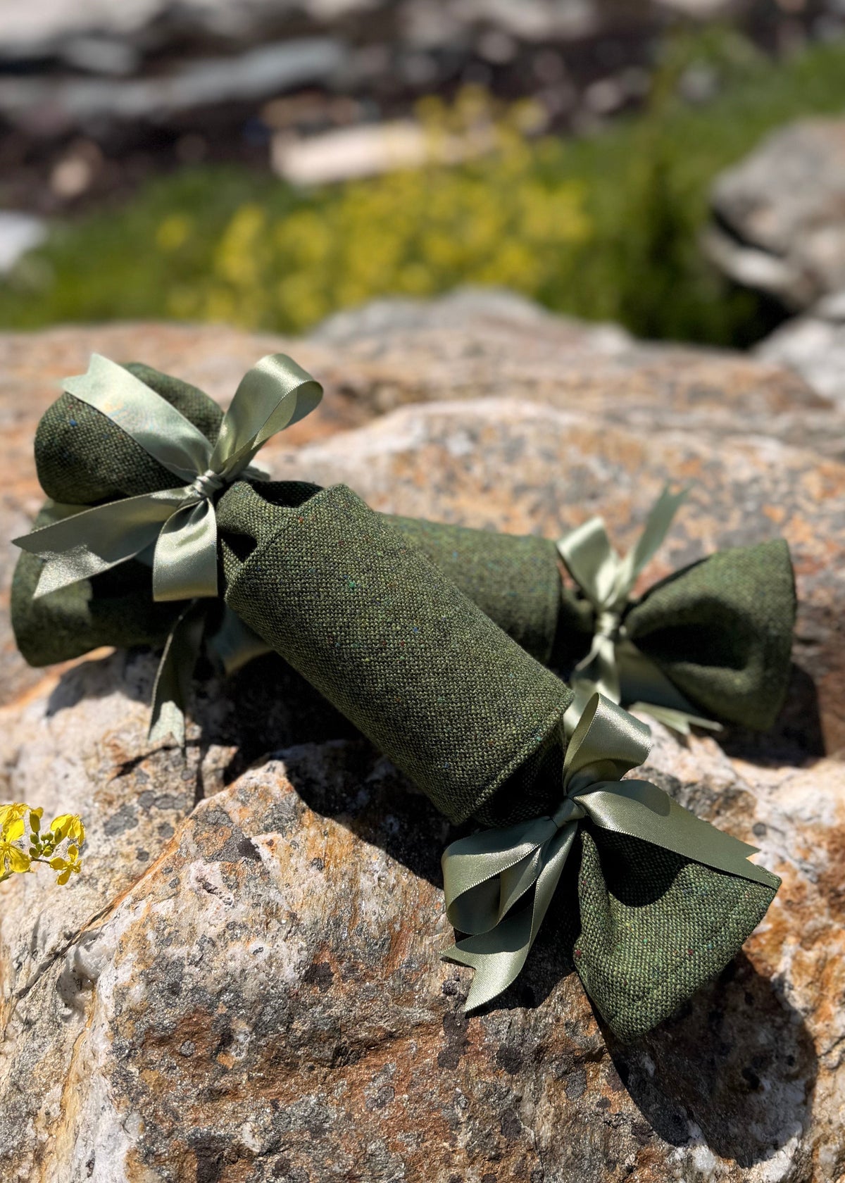 Handcrafted in Ireland, our Yuletide Tweed Christmas Crackers combine the heritage of Irish weaving with the timeless tradition of the Christmas cracker.

Design & Materials

Each cracker is made using authentic Magee Donegal Tweed in Eske – Green Salt & Pepper Flecked Donegal Tweed. The rich green tones and subtle flecking are inspired by the Irish landscape, while luxurious satin ribbon bows add an elegant festive finish.

Reusable, Refillable & Sustainable

