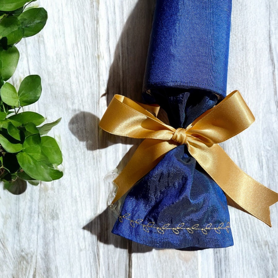 Luxury celebration crackers close up of sleeve and embroidery gold detail